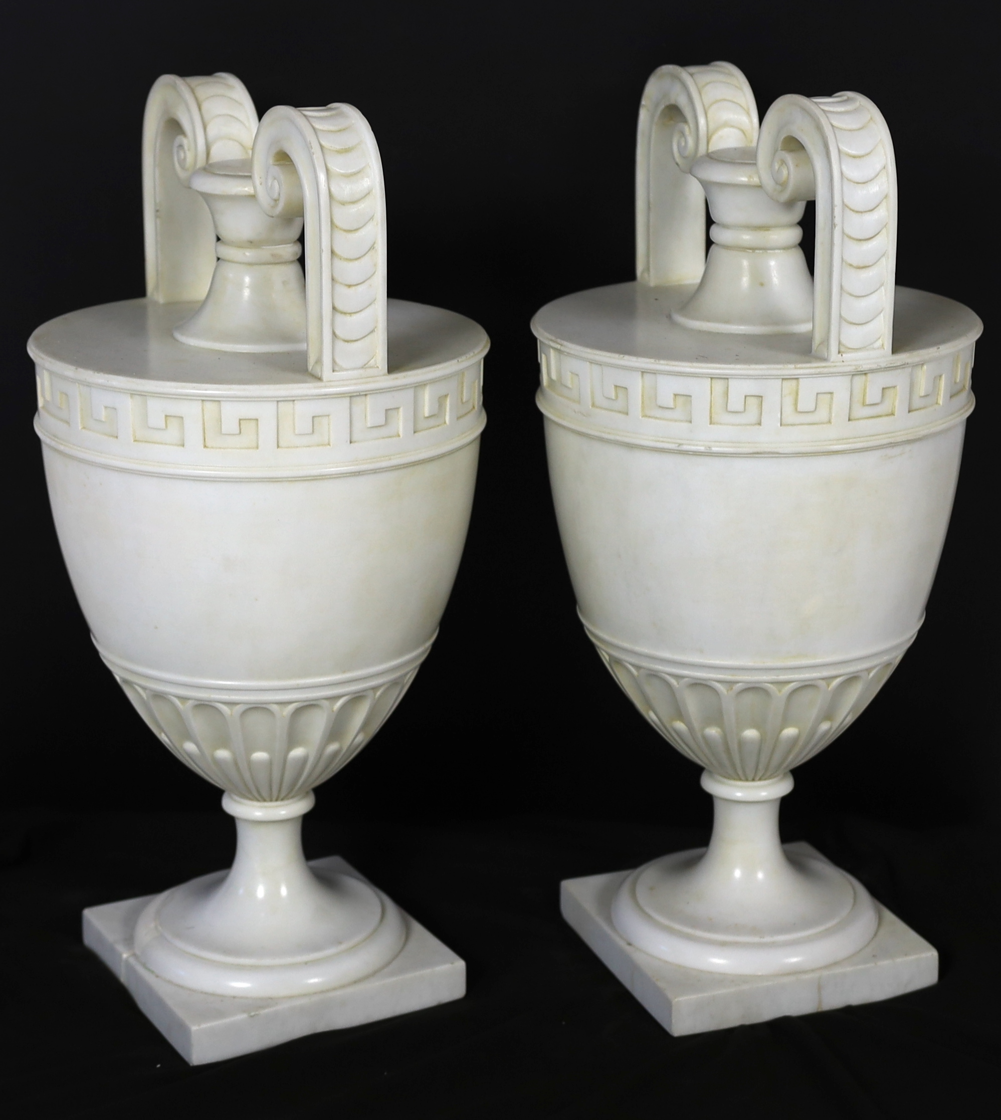 A pair of Italian neo-classical Carrara marble vases, 24cm diameter, 50cm high, Please note this lot attracts an additional import tax of 5% on the hammer price